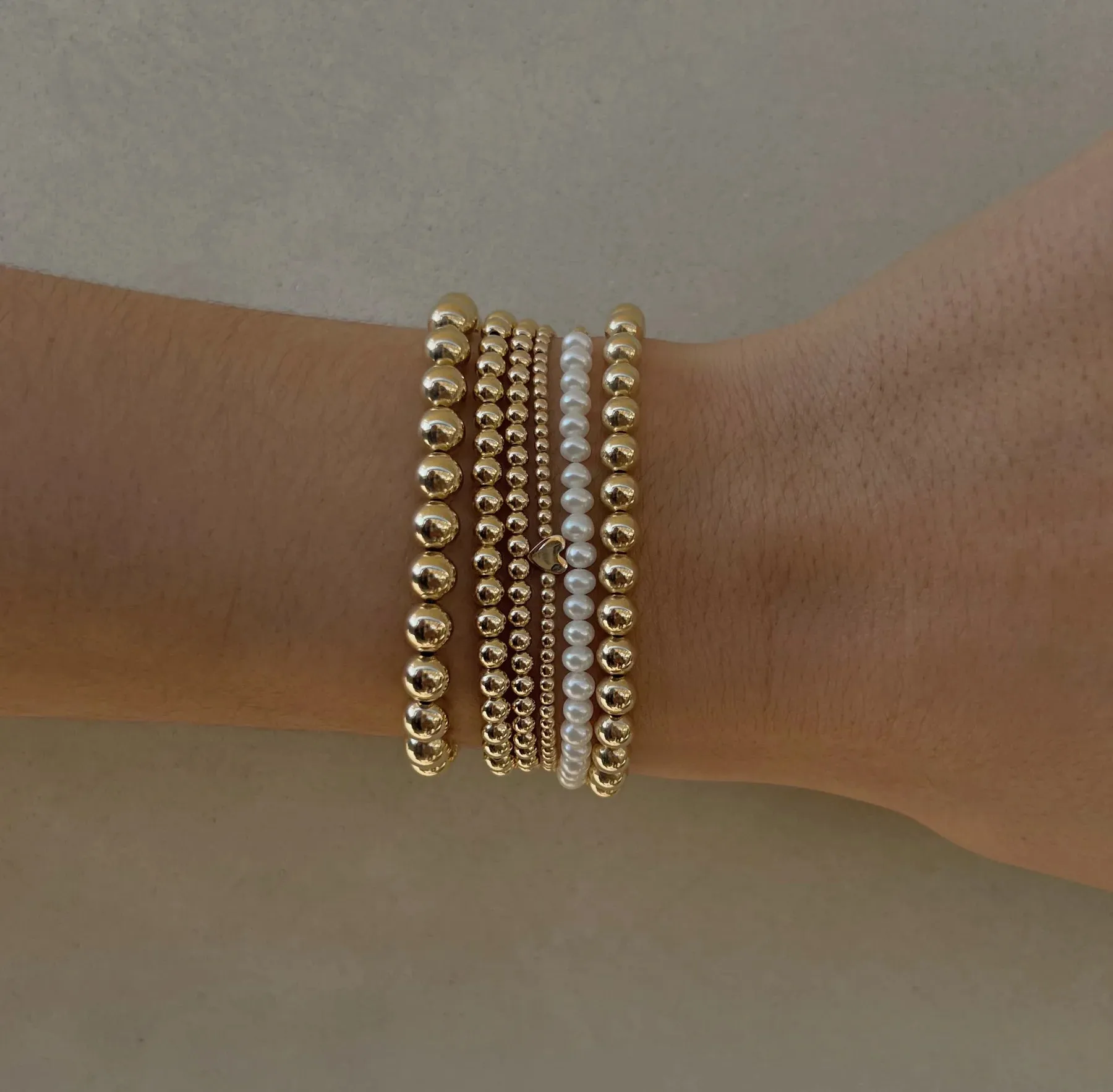 Karen Lazar  - 2 mm Yellow Gold Filled Bead Flex Bracelet with White Pearls Halfway