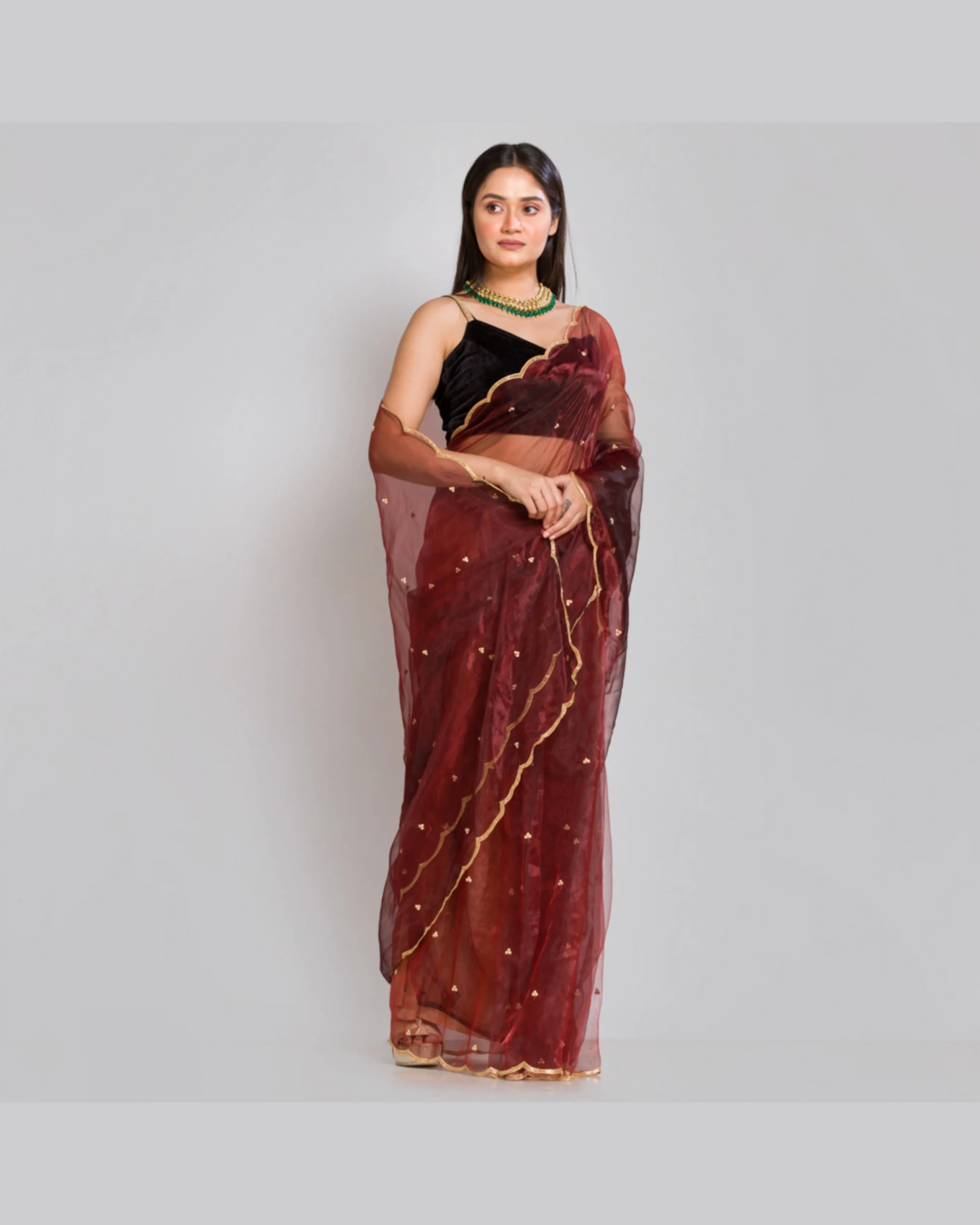 Maroon glass tissue saree with Handembroidered scalloping