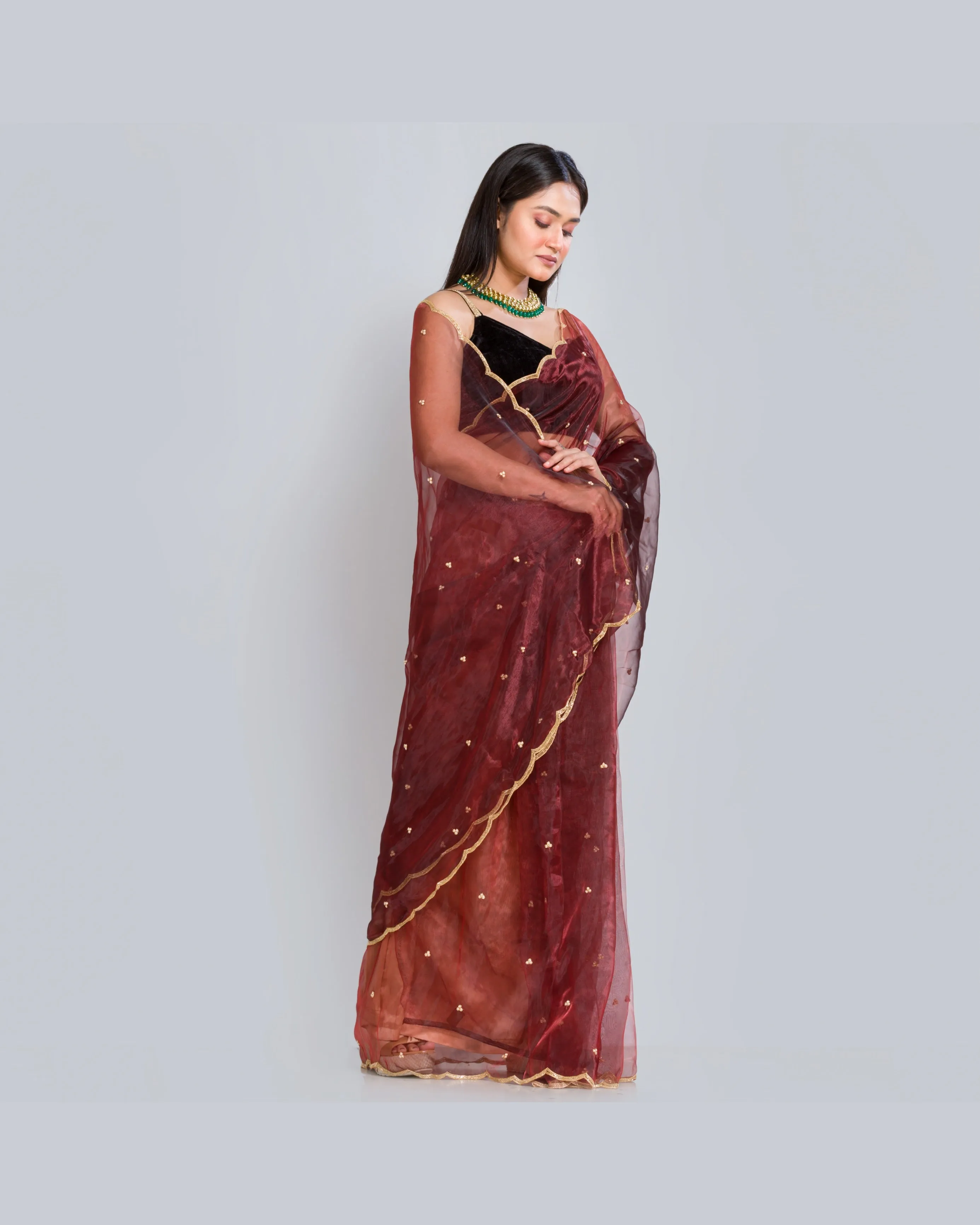 Maroon glass tissue saree with Handembroidered scalloping