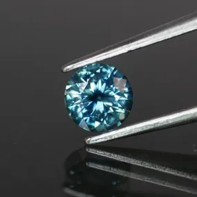 Sapphire | natural, teal color, round cut 5.5 mm, 0.7ct